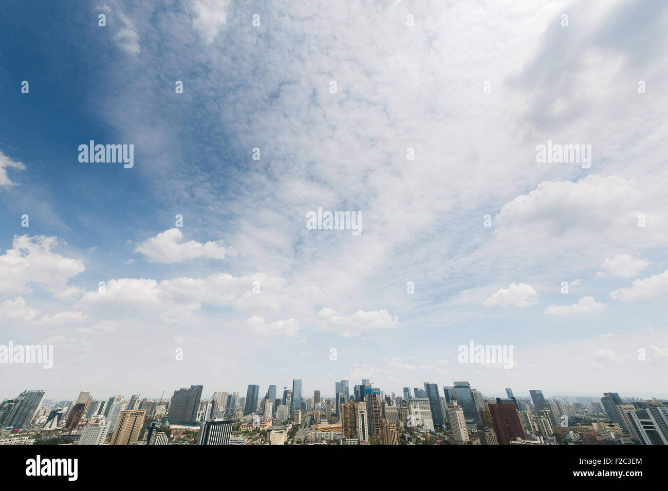 Chengdu skyline aerial view with blue sky and white clouds Stock Photo