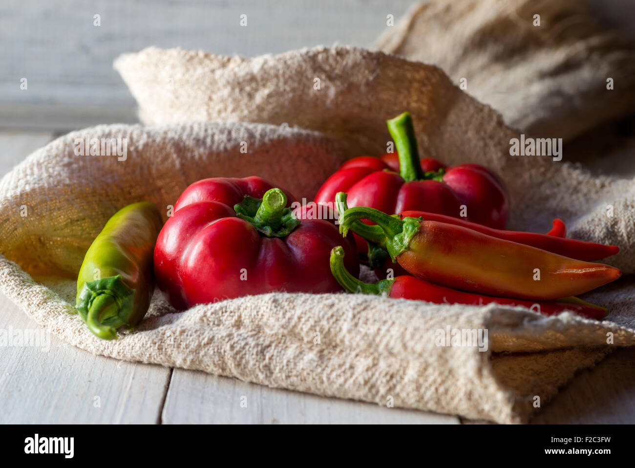 red paprika and pepper on a wooden table Stock Photo - Alamy