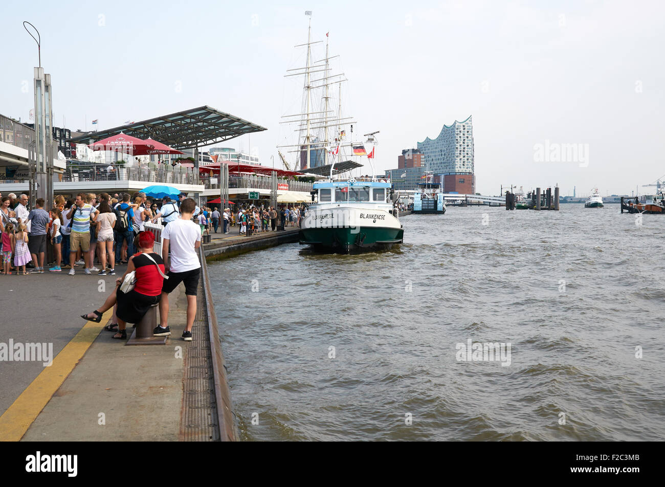 HAMBURG, GERMANY - AUGUST 14, 2015: Ferrys at Landungsbruecken jetty pier, Hamburg harbor Stock Photo