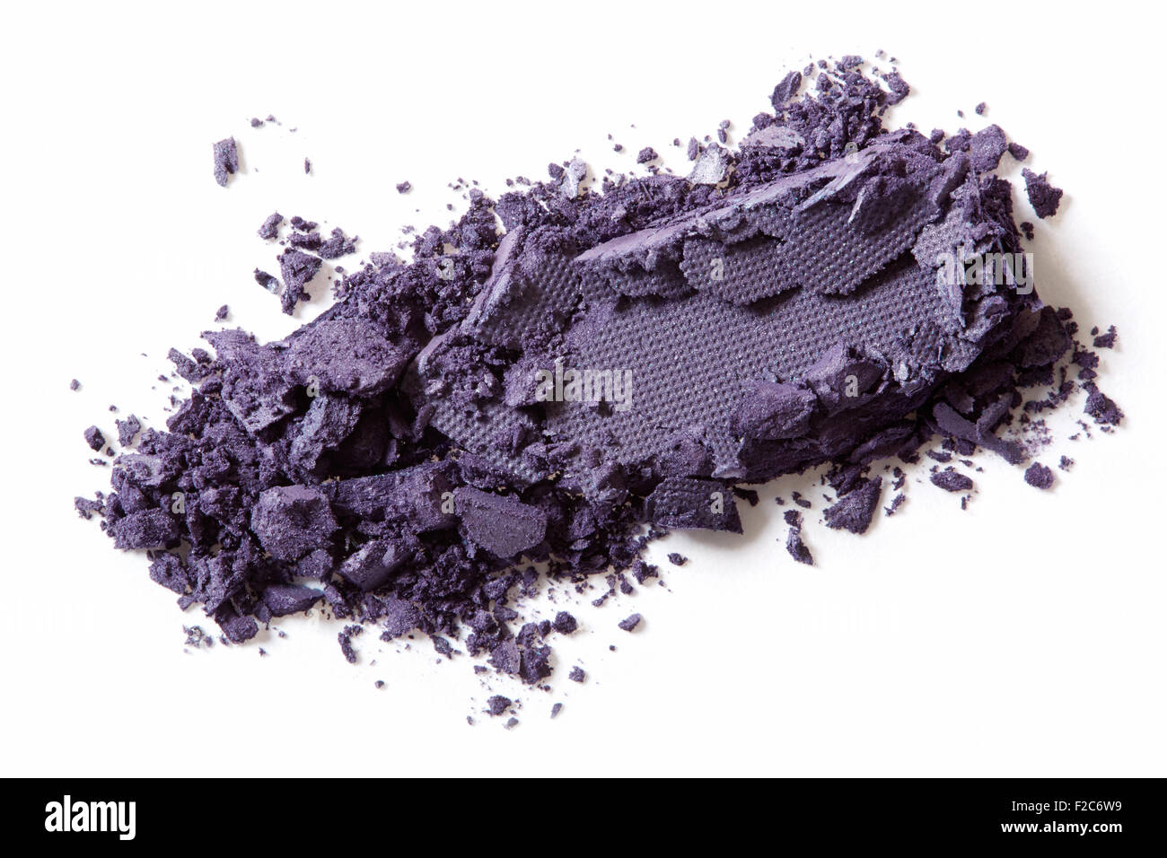 Dark purple eye shadow crushed on white background Stock Photo