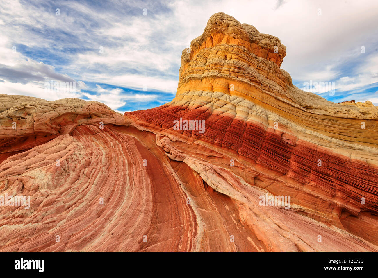 Striped sandstone rock formation at the White Pocket Stock Photo