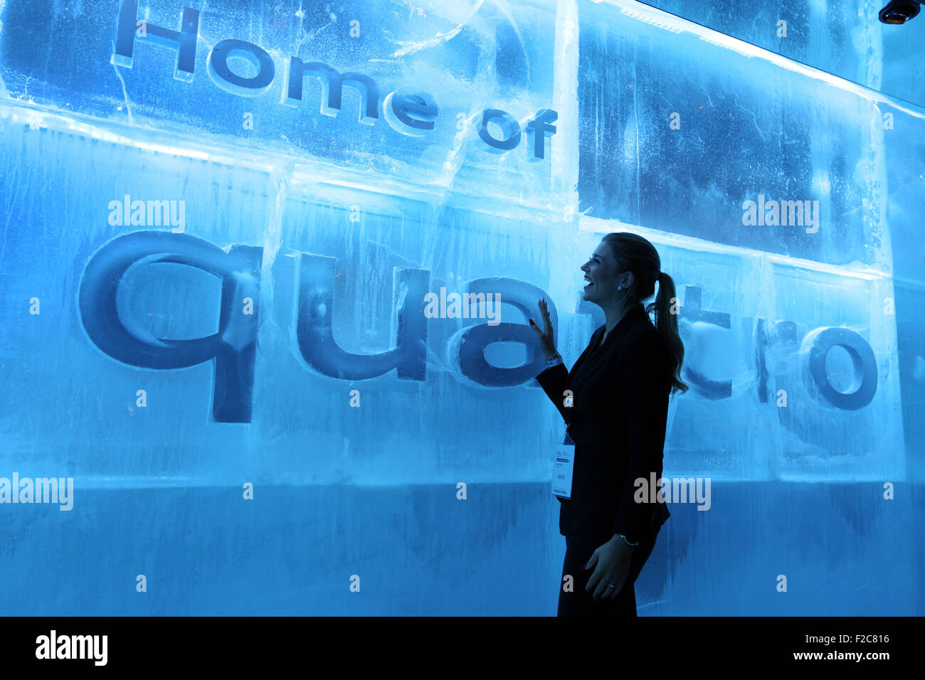 Frankfurt/M, 15.09.2015 - Visitor touching real ice blocks at the entrance of the AUDI stand at the 66th International Motor Show IAA 2015 (Internationale Automobil Ausstellung, IAA) in Frankfurt/Main, Germany Stock Photo