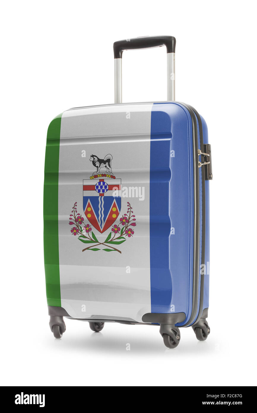 Suitcase painted into Canadian territory or province flag series - Yukon Stock Photo