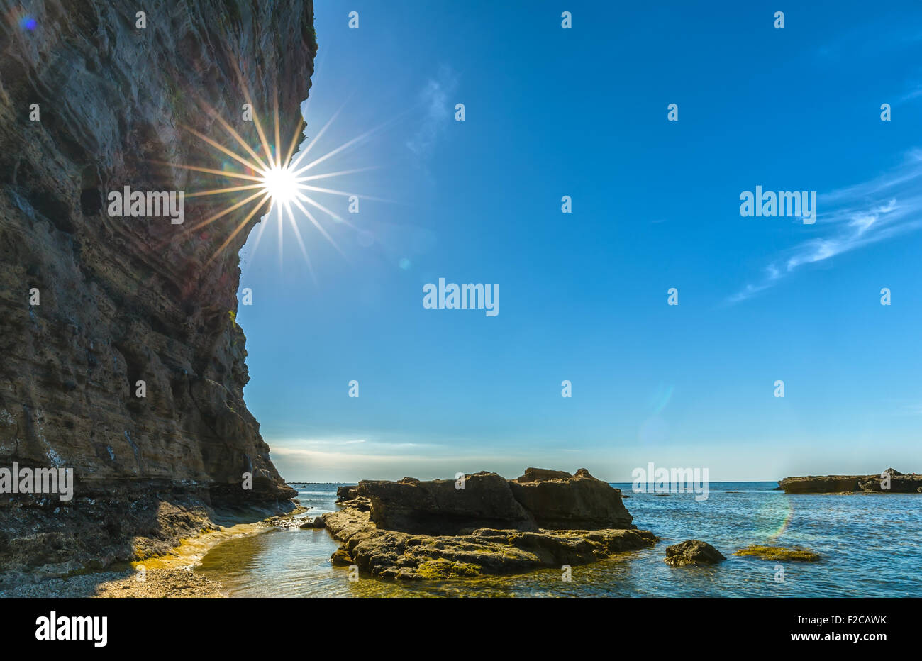 Sunstar afternoon cliff side fire Stock Photo