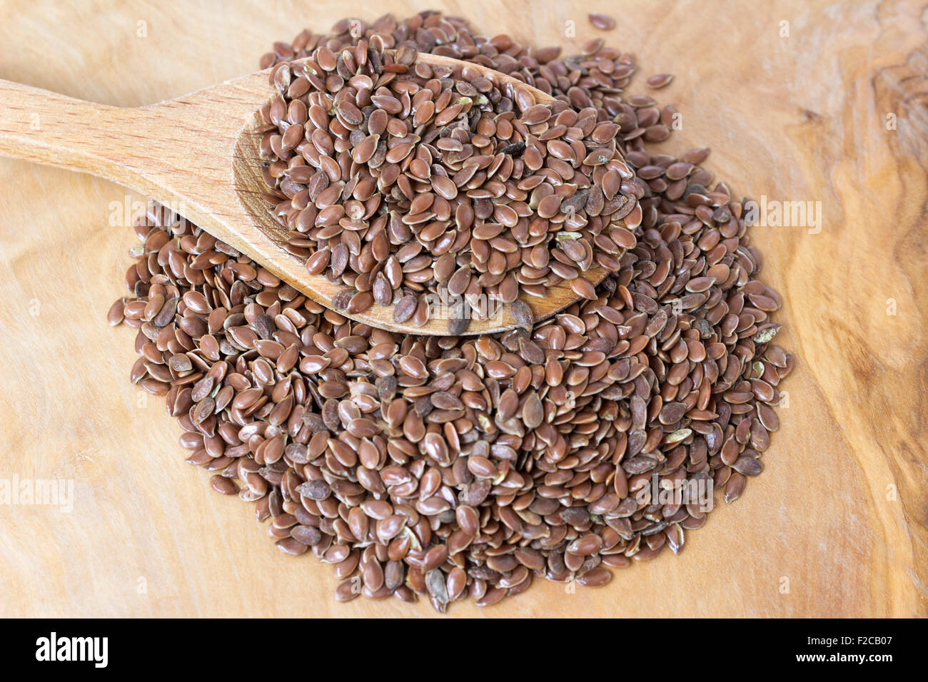 Flax seeds with a wooden spoon-close up Stock Photo