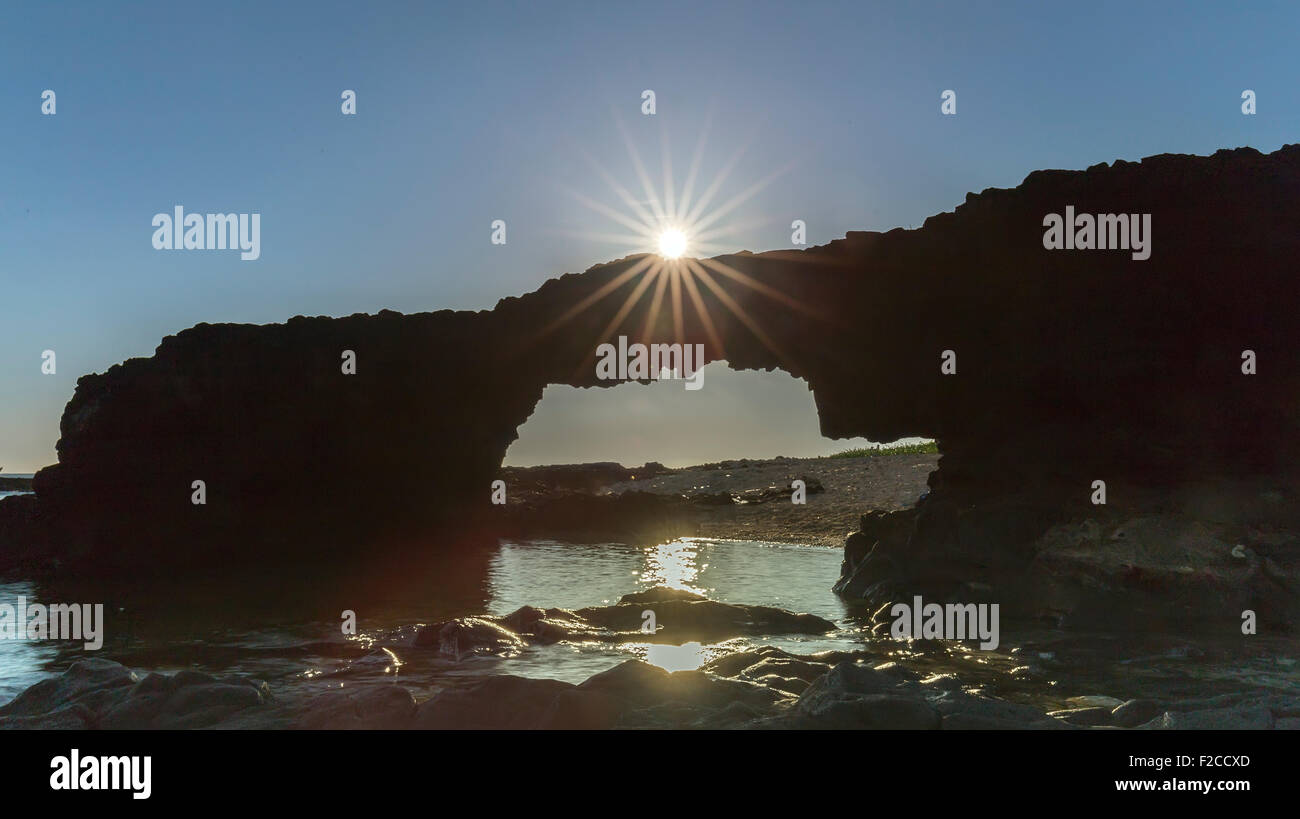 Sunrise atop the stone arch gate Ly Son Island Stock Photo