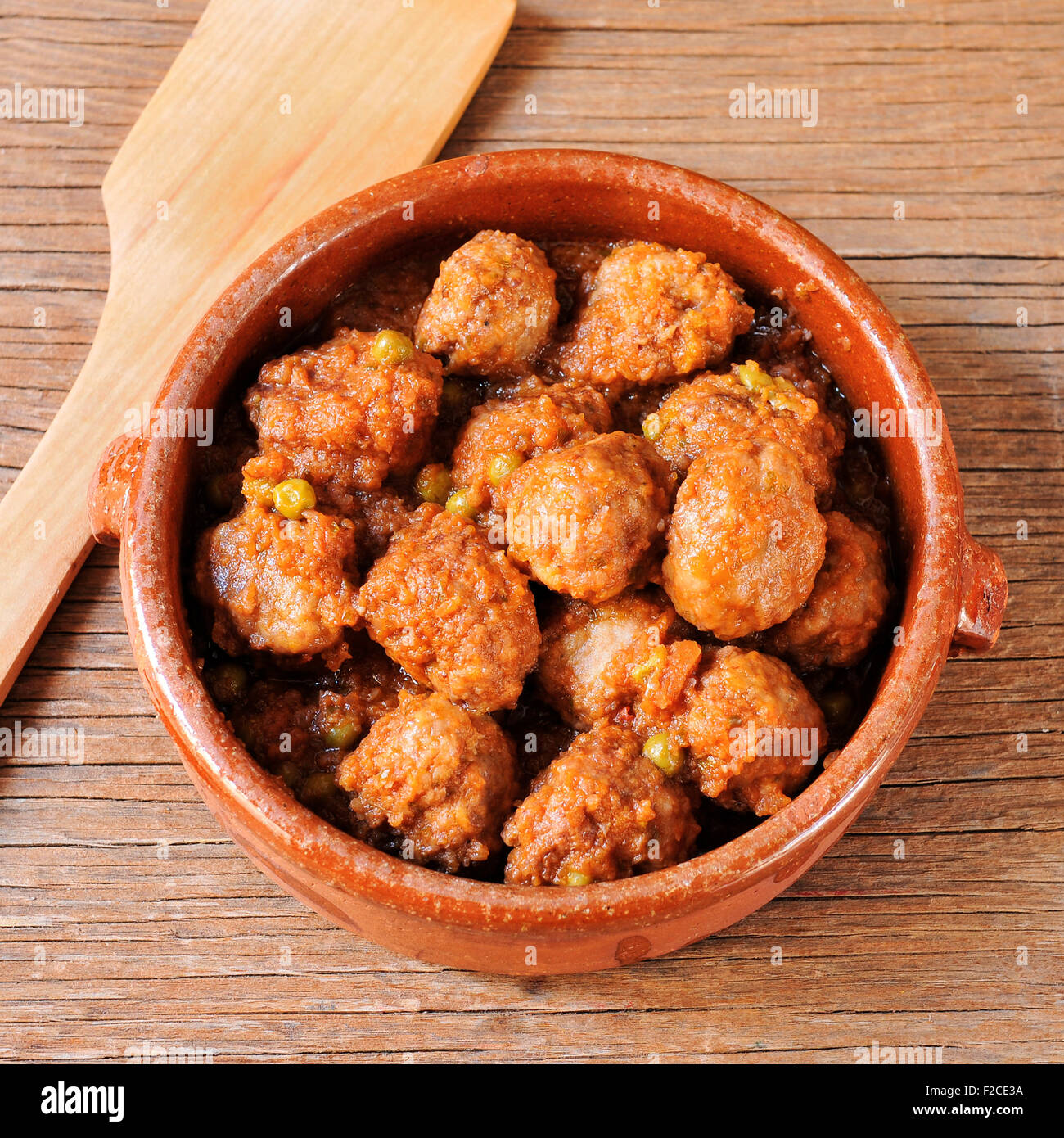 closeup of an earthenware bowl with a spanish meatballs stew on a
