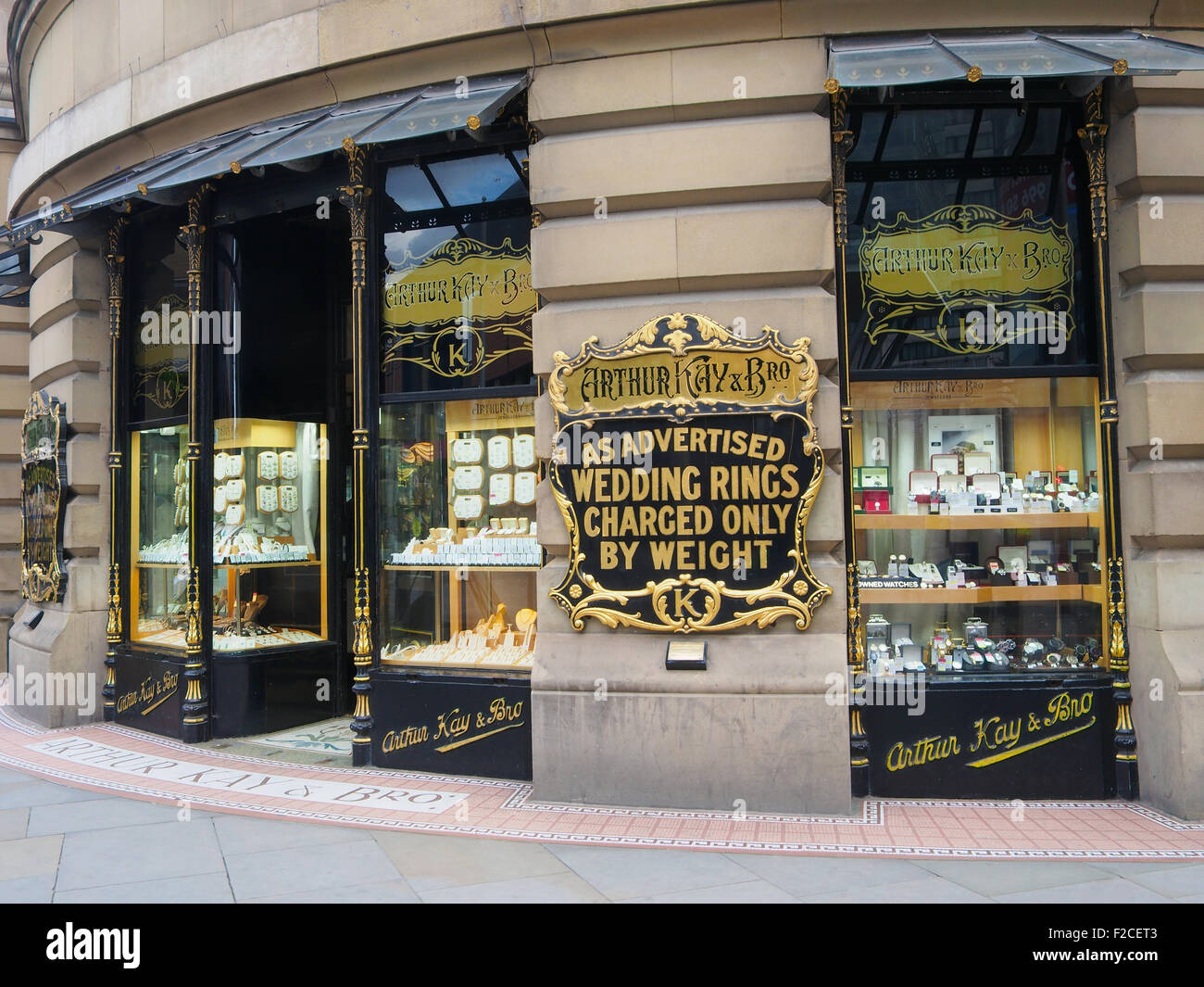 Shop window display of a jewellers specializing in gold in Manchester, city centre, UK. Stock Photo