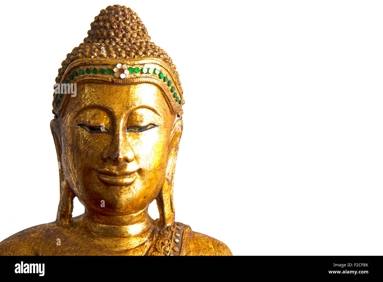 Decorative sculpture of Buddha head in gold color Stock Photo