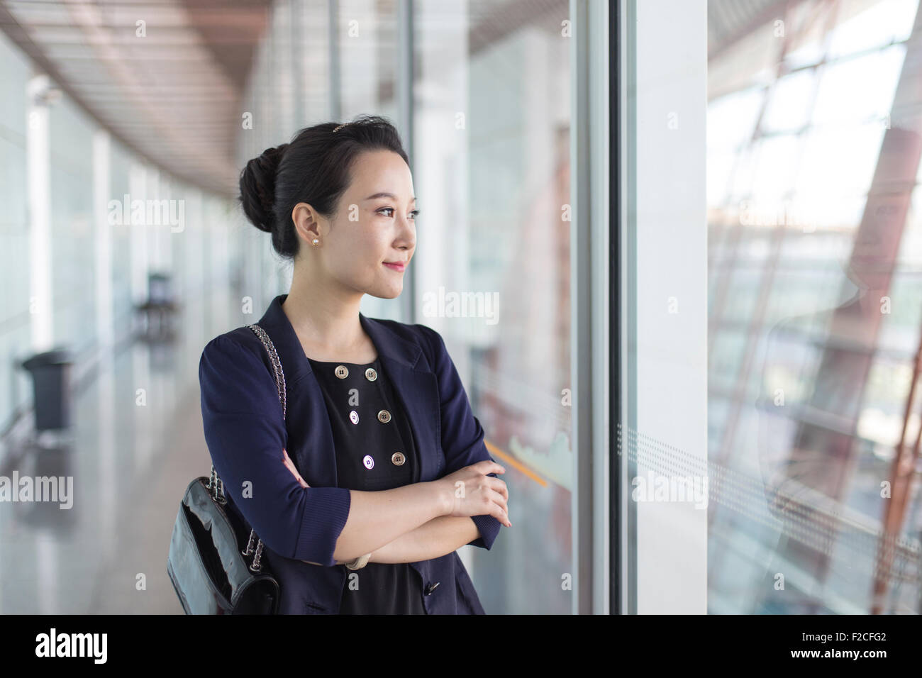 Businesswoman at Beijing Capital International Airport T3 Stock Photo