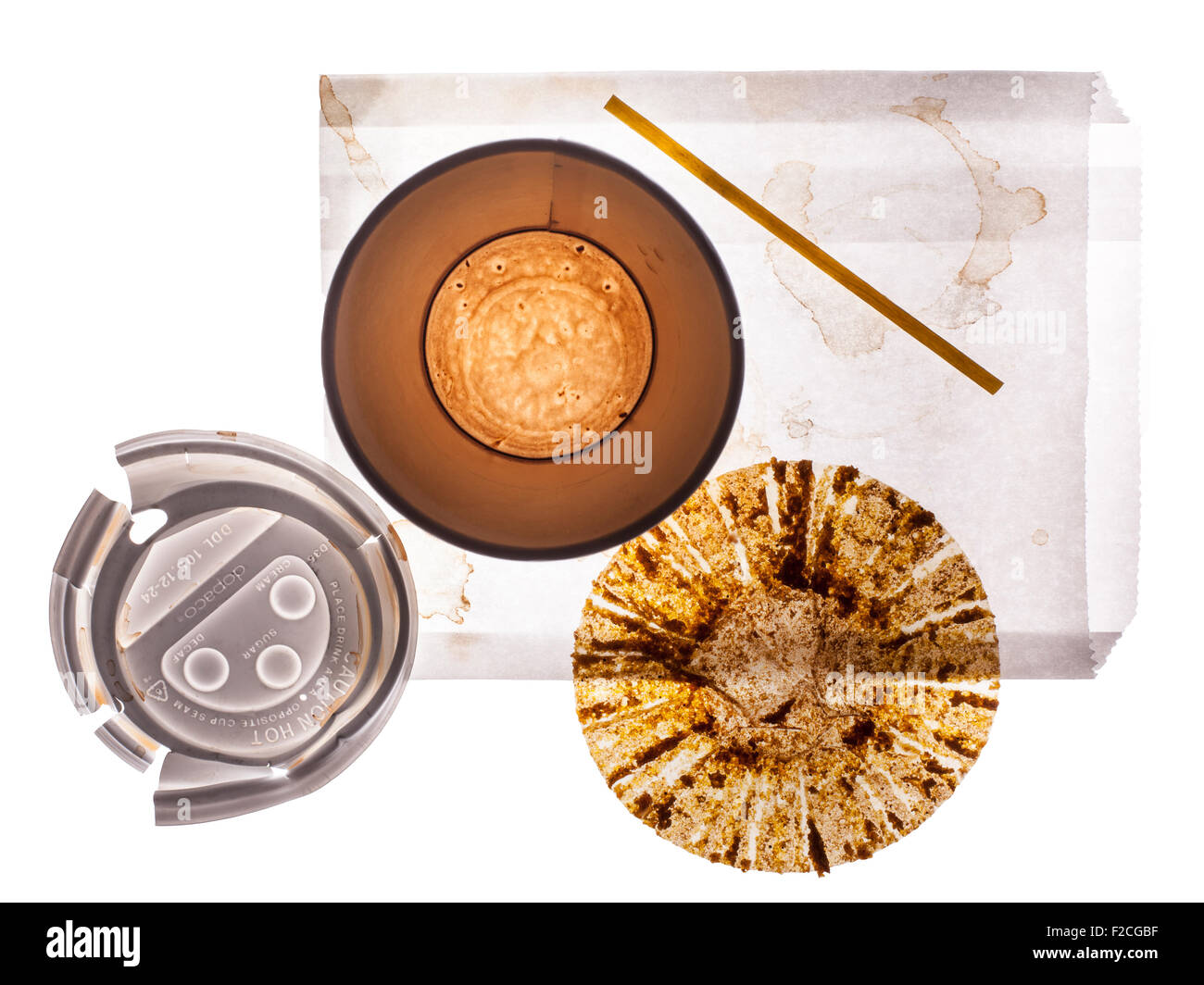 overhead view of empty paper coffee cup, lid, empty muffin wrapper, stir stick, white paper bag Stock Photo