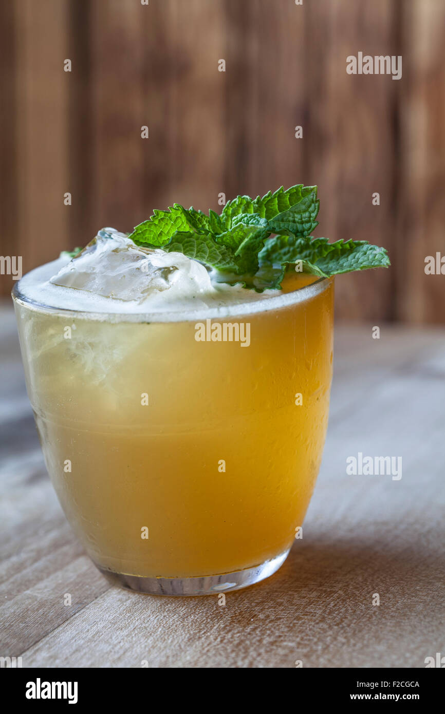 side view of cocktail in short glass with mint garnish Stock Photo