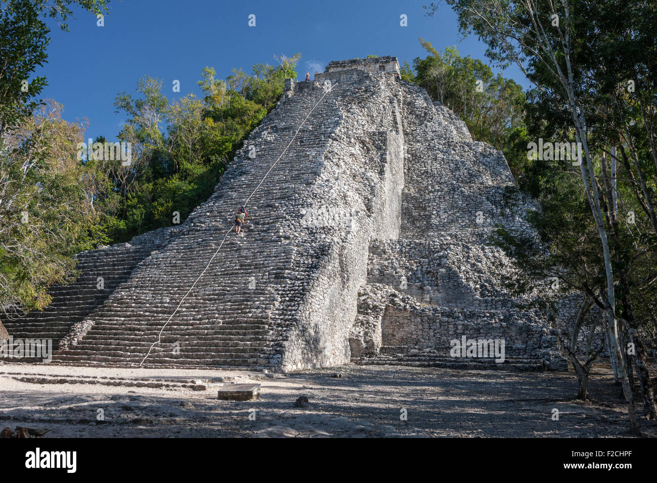 Climbers ascending Nohoch Mul pyramid at Coba Mayan ruins, Quintana Roo, Yucatan, Mexico Stock Photo