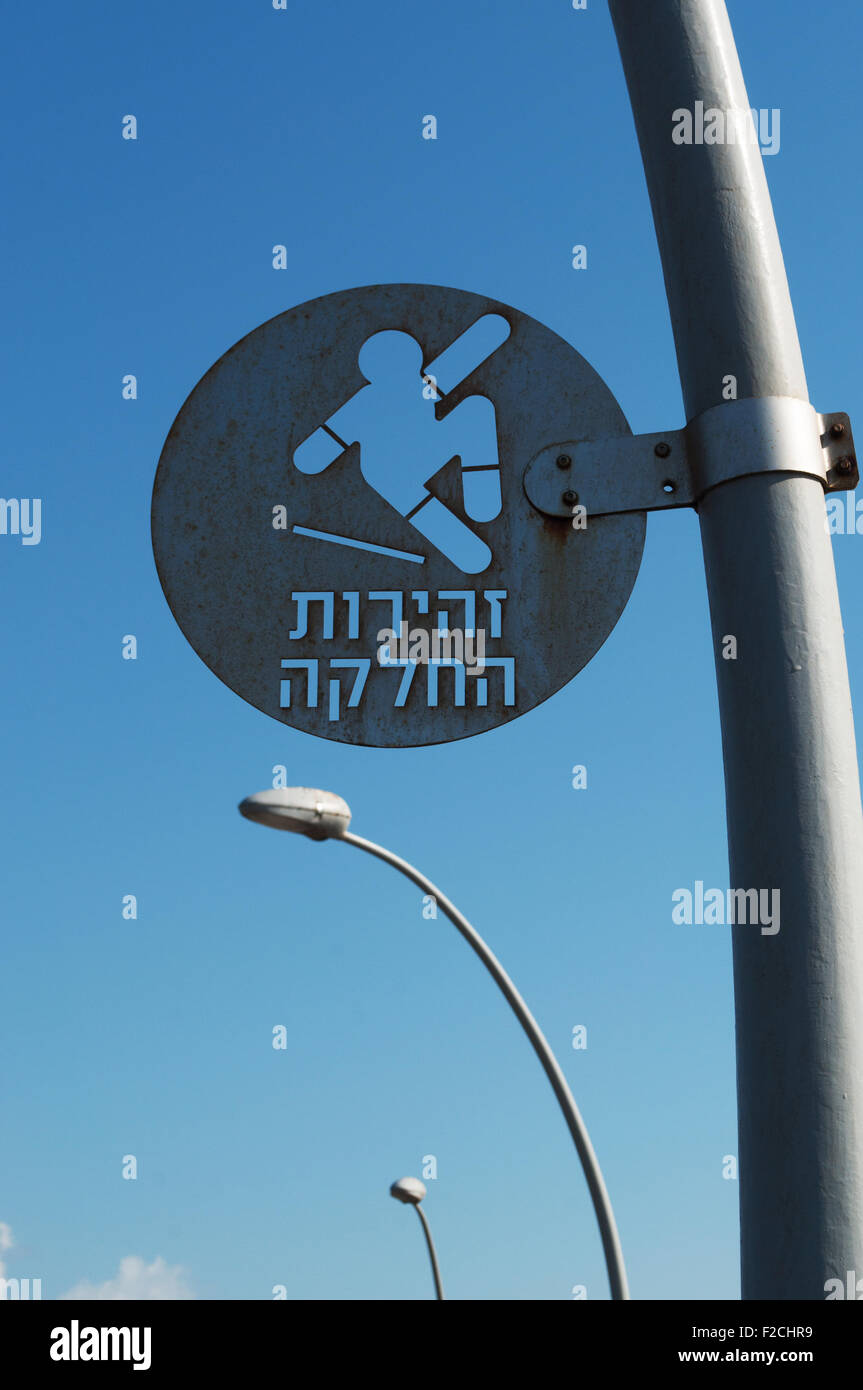 Israel: a jewish signal on Tel Aviv pier, be careful, slippery ground, skaters, skateboard Stock Photo