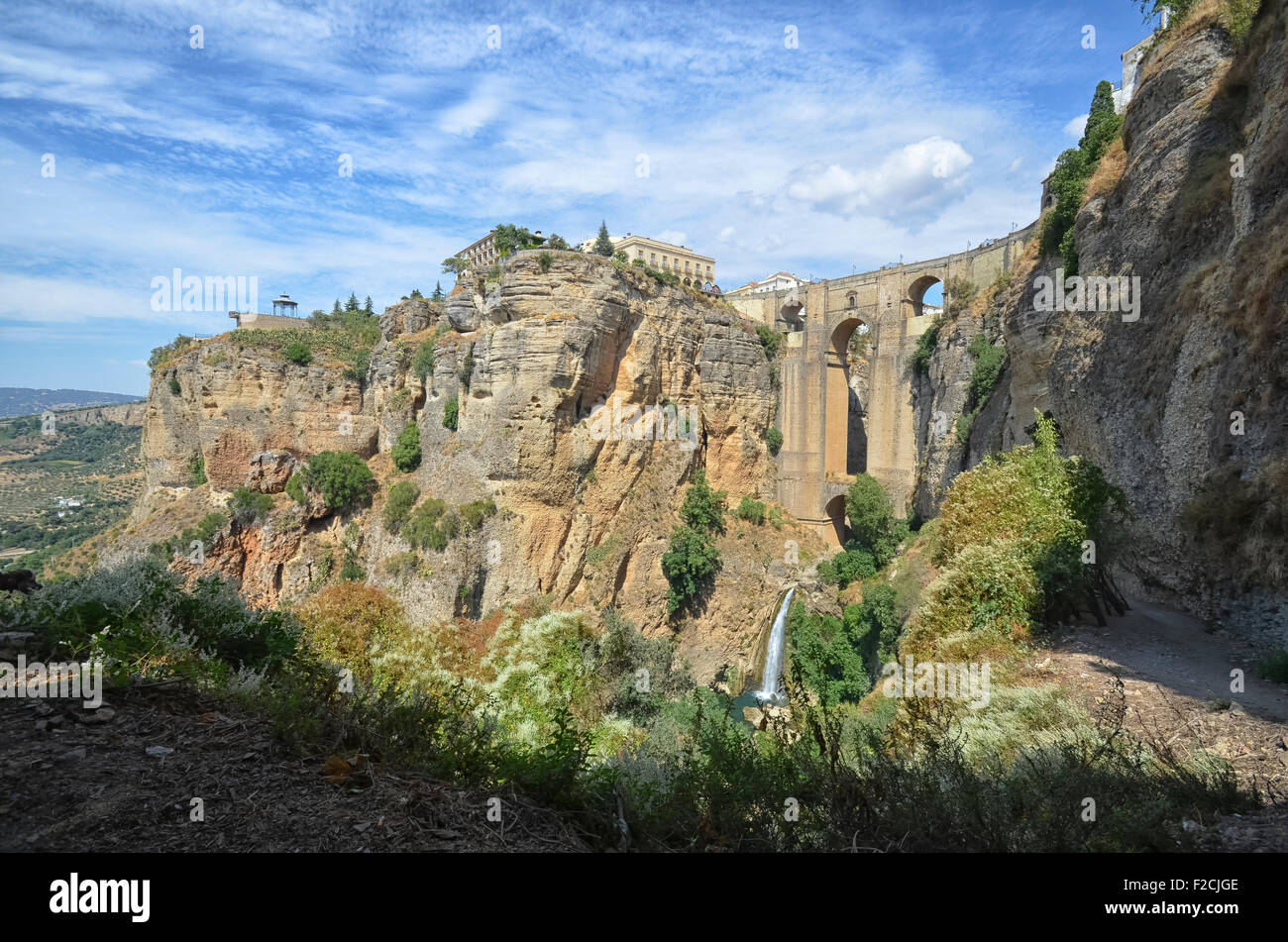 View of the waterfall and the bridge of Ronda Stock Photo
