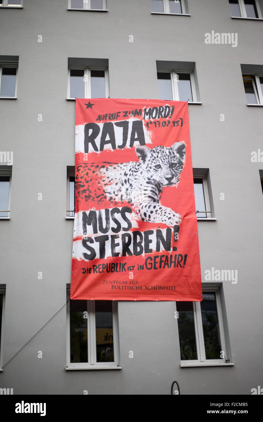 A banner reading 'Raja muss sterben!' (Raja must die) hangs at the Theatre Dortmund, in Dortmund, Germany, 16 Septemeber 2015. With an alleged killing of animals in the Dortmund Zoo, the Berlin artists' group 'Center for Political Beauty' (ZPS) wants to steer the views of the public on the continued suffering in Syria. Photo: MAJA HITIJ/dpa Stock Photo