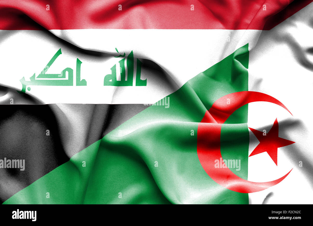 Waving flag of Algeria and Iraq Stock Photo