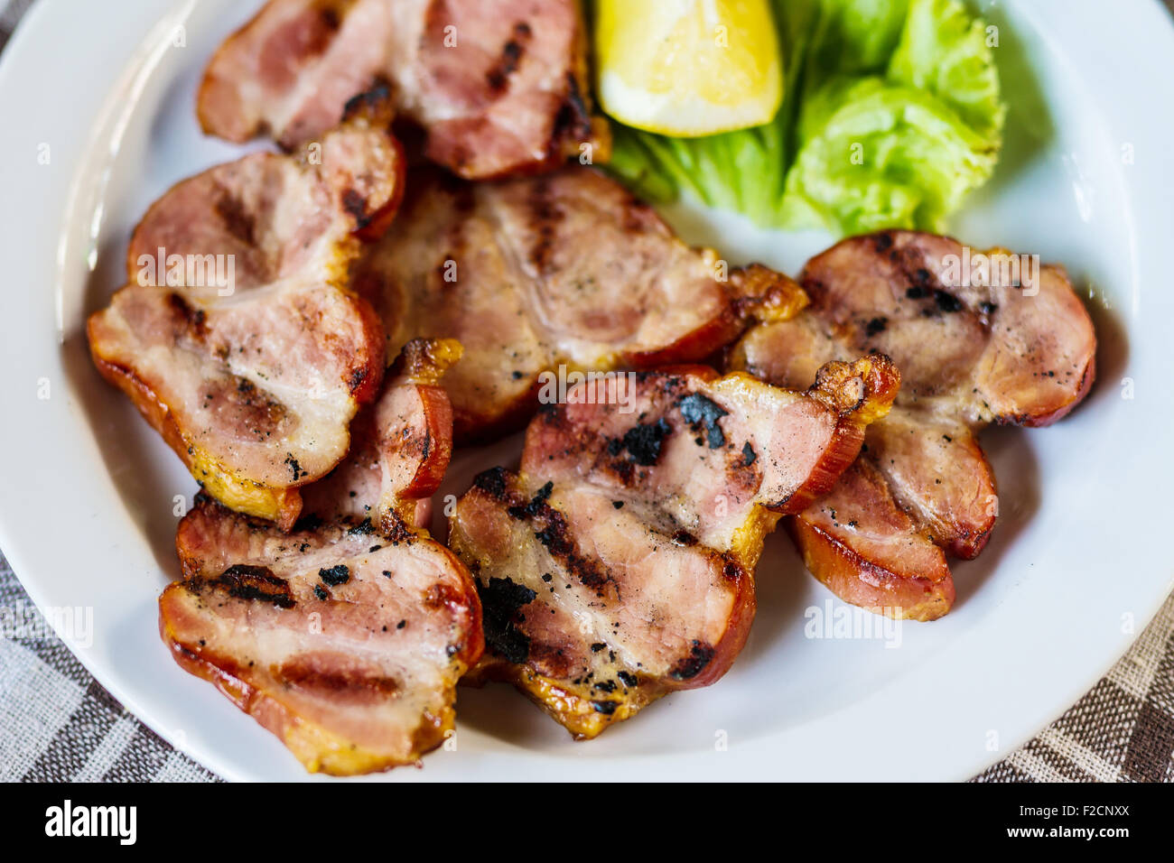 Fresh pork meat in restaurant. Appetizer roast meat. Stock Photo