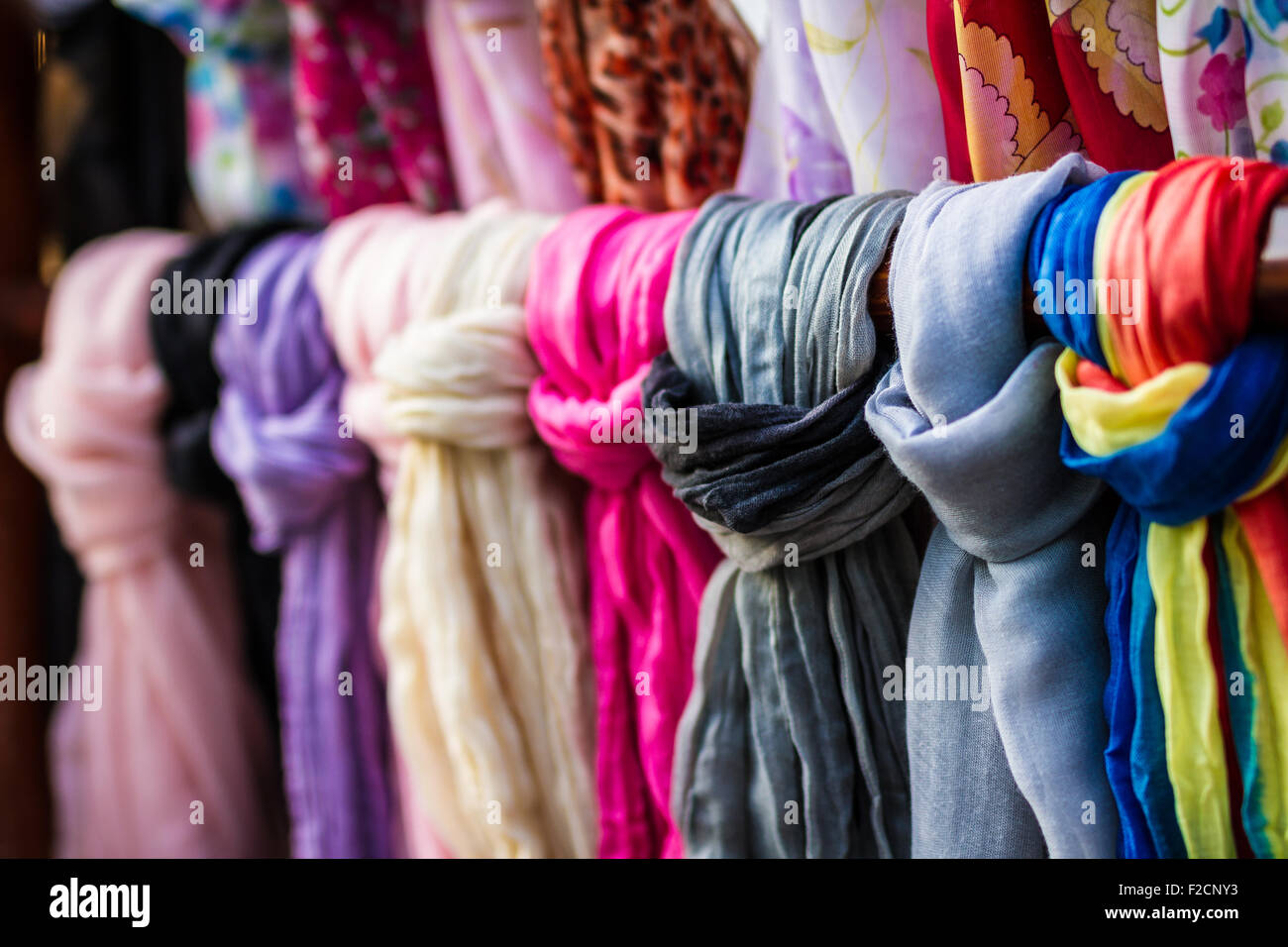Rolls of textile, cloth and tissue of various colours on the market Stock Photo
