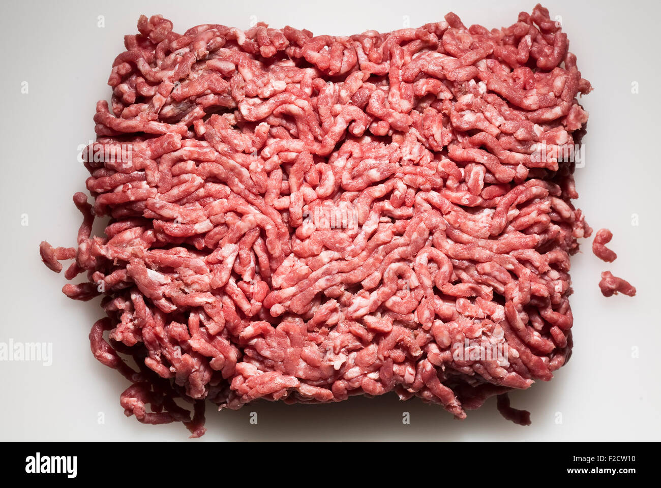 Overhead view of ground beef on white background Stock Photo