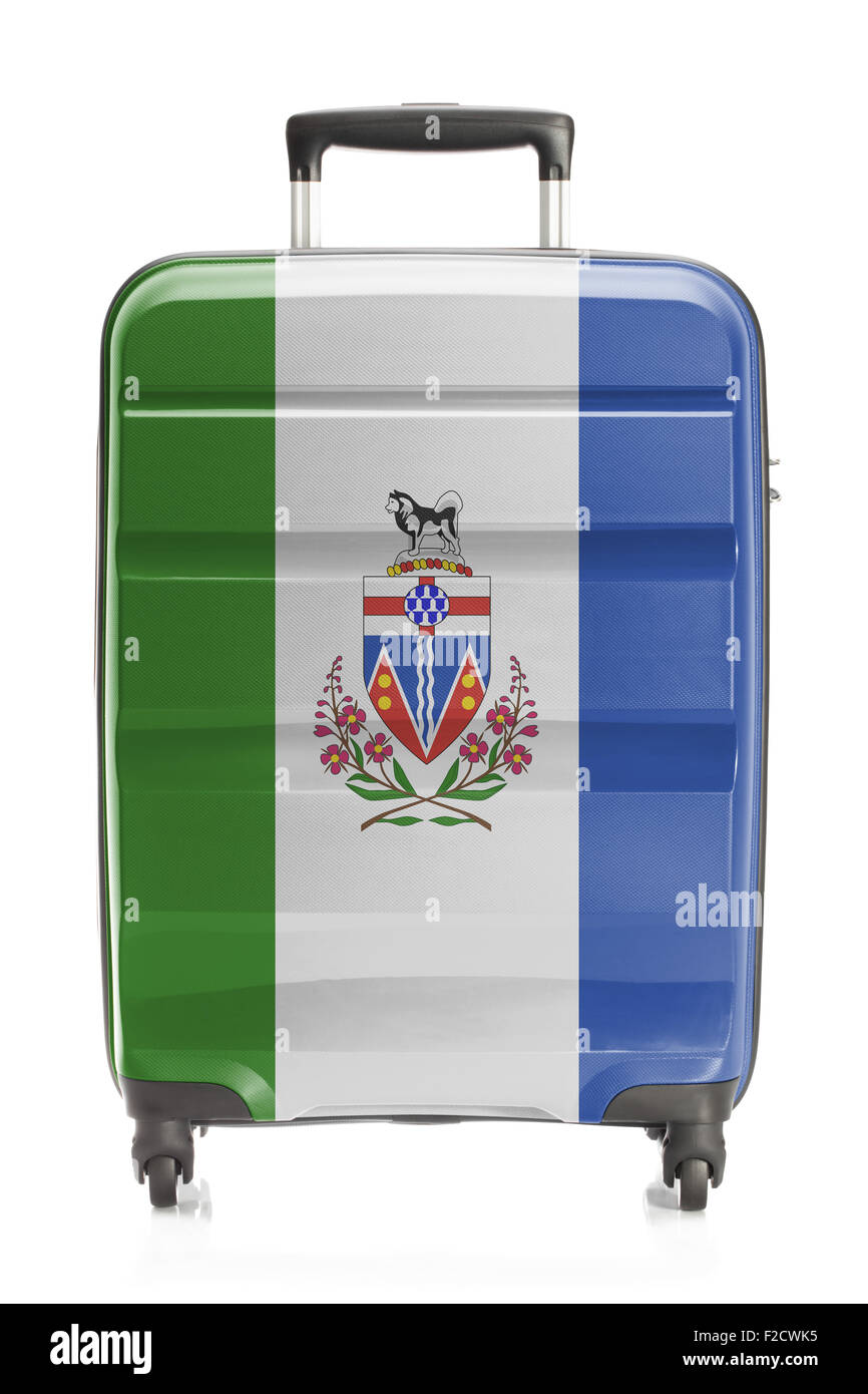 Suitcase painted into Canadian territory or province flag series - Yukon Stock Photo