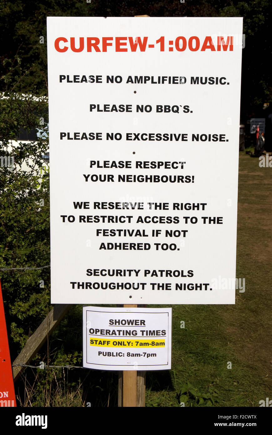 Curfew information sign near temporary campsite for visitors attending the 3-day Wayfest Music Festival 2015, Rural Life Centre, Stock Photo