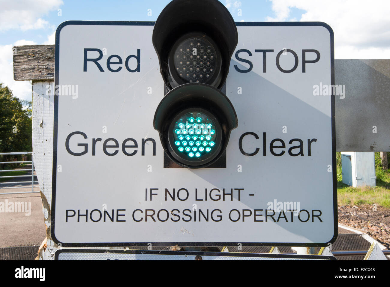 Train crossing green light Stock Photo