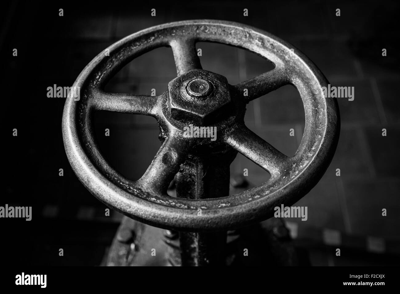 old handwheel of valve. Black and white Stock Photo