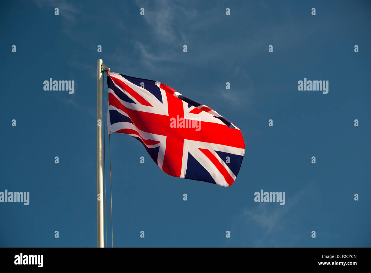 Great Britain flag in front of a blue sky Stock Photo