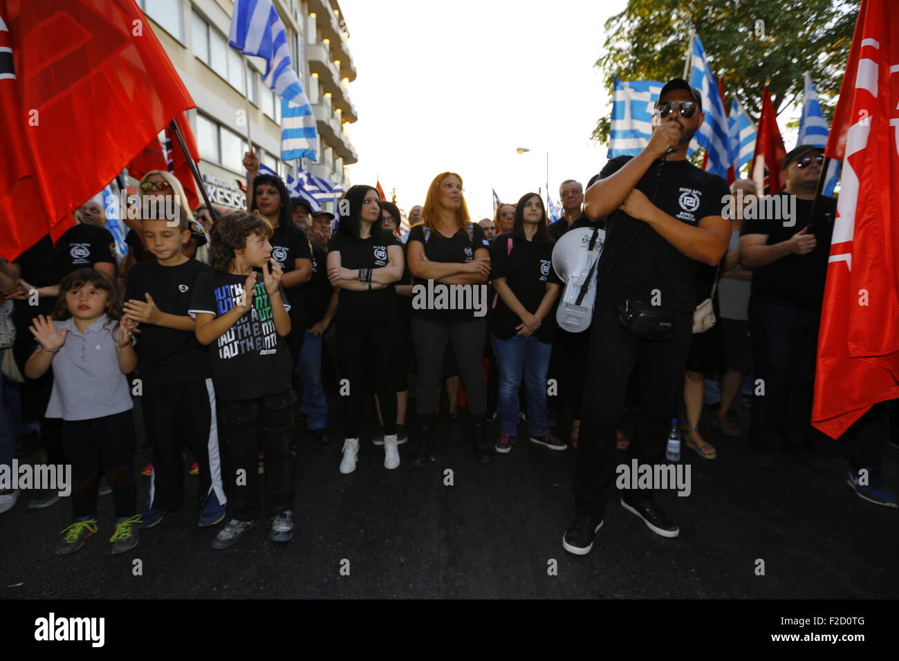 Athens, Greece. 16th September 2015. A man shouts slogans to the crowd through a megaphone at the Golden Dawn election rally. Greek right wing  party Golden Dawn held an election rally in Athens, four days ahead of election day. The party hopes to gain enough seats in the election to become the third latest party in the Greek Parliament. Credit:  Michael Debets/Alamy Live News Stock Photo