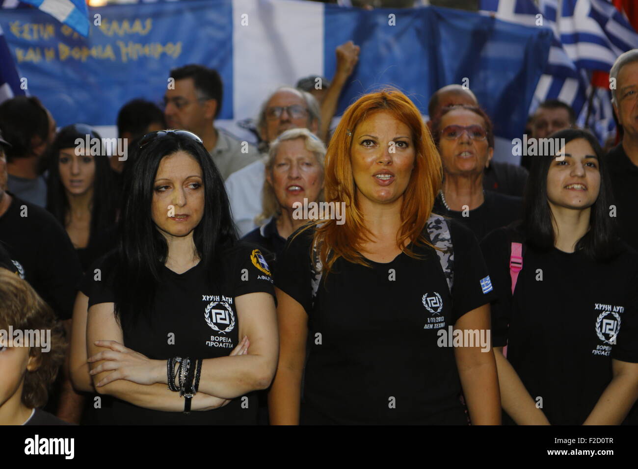 Athens, Greece. 16th September 2015. Golden Dawn supporters listen to a speech at the  election rally in Athens Greek right wing  party Golden Dawn held an election rally in Athens, four days ahead of election day. The party hopes to gain enough seats in the election to become the third latest party in the Greek Parliament. Credit:  Michael Debets/Alamy Live News Stock Photo