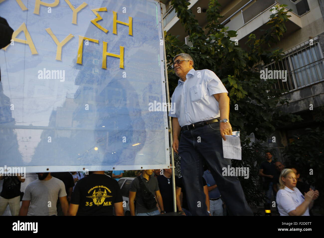 Athens, Greece. 16th September 2015. Nikolaos Michaloliakos, the General Secretary of Golden Dawn, gets on the stage at the election rally. Greek right wing  party Golden Dawn held an election rally in Athens, four days ahead of election day. The party hopes to gain enough seats in the election to become the third latest party in the Greek Parliament. Credit:  Michael Debets/Alamy Live News Stock Photo
