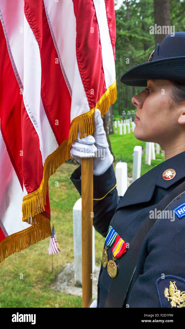 Female Military Honor Guard holding the staff of the American Flag at a Memorial Day ceremony at Ft. Lewis, Washington.  25 May, Stock Photo