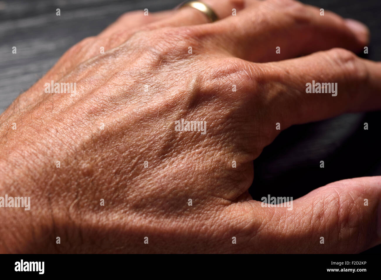 Close up of the back of a married male left hand Stock Photo