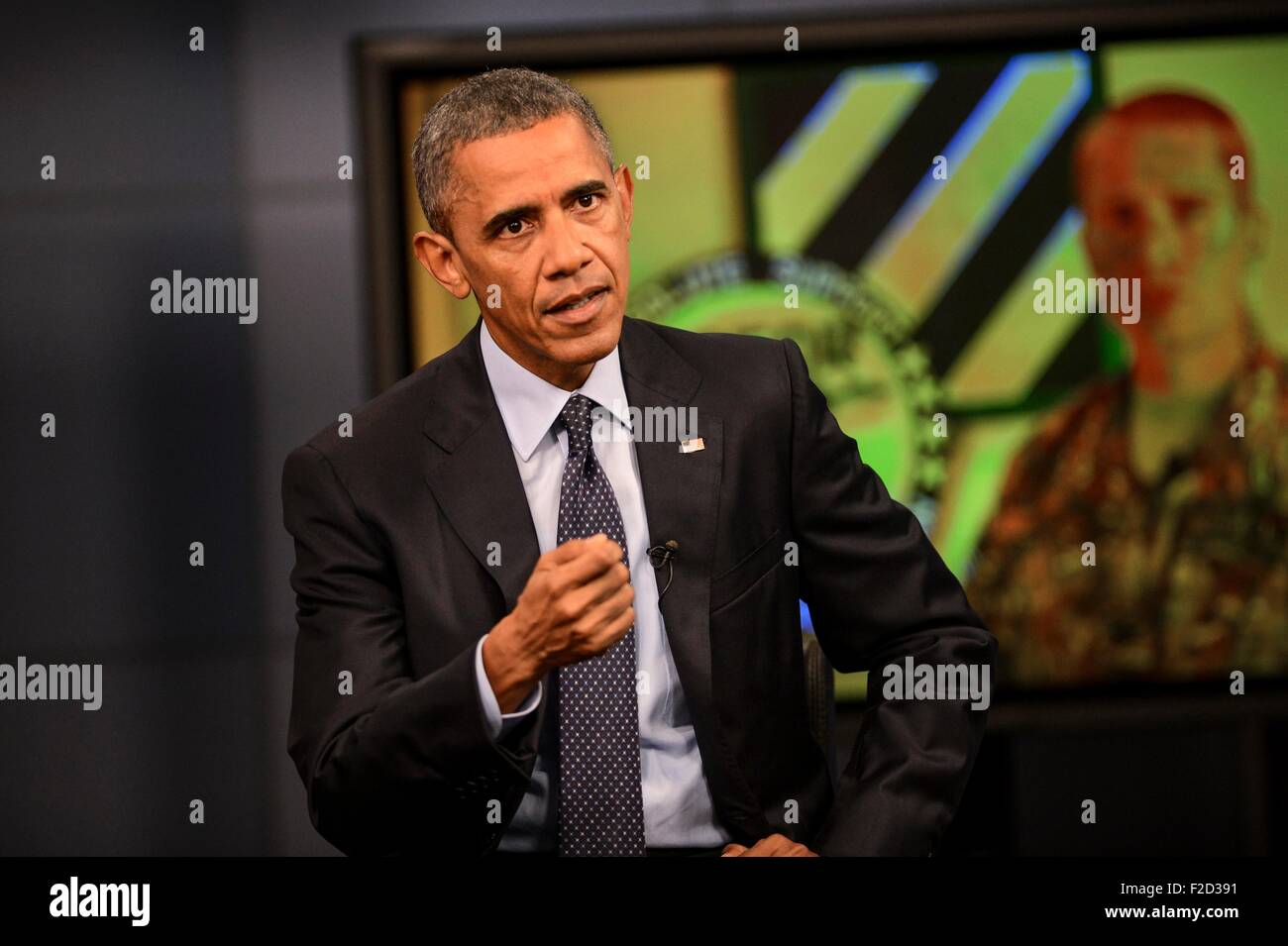 U.S. President Barack Obama answers questions from service members ...