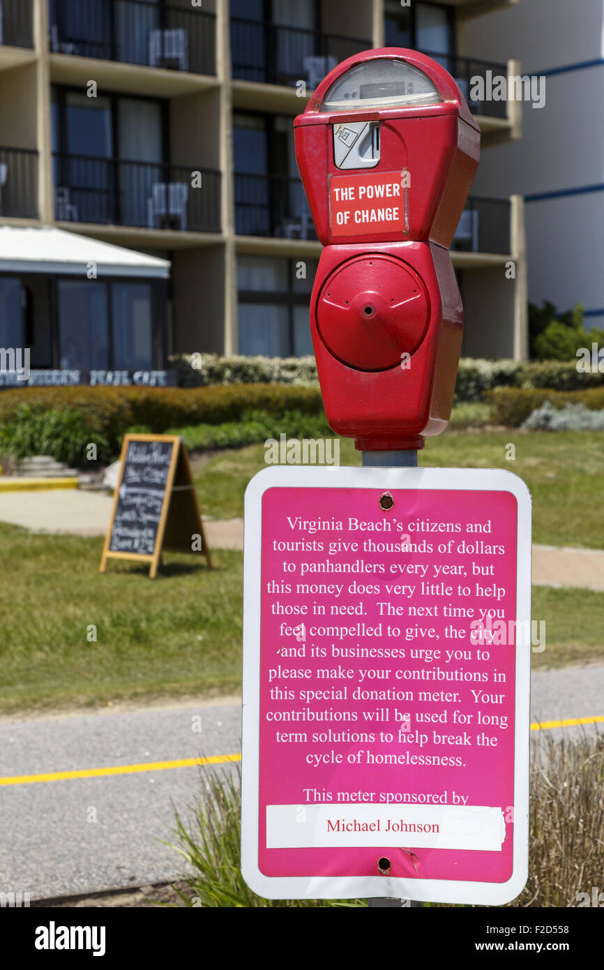 Parking meter converted to Donation meter Virginia Beach Boardwalk Oceanfront to combat panhandling and help the homeless Stock Photo