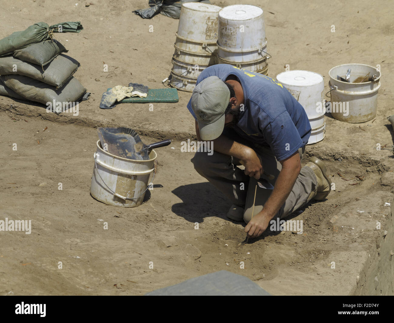 Jamestown Rediscovery archaeologist kneeling surroundded by buckets and tools Stock Photo