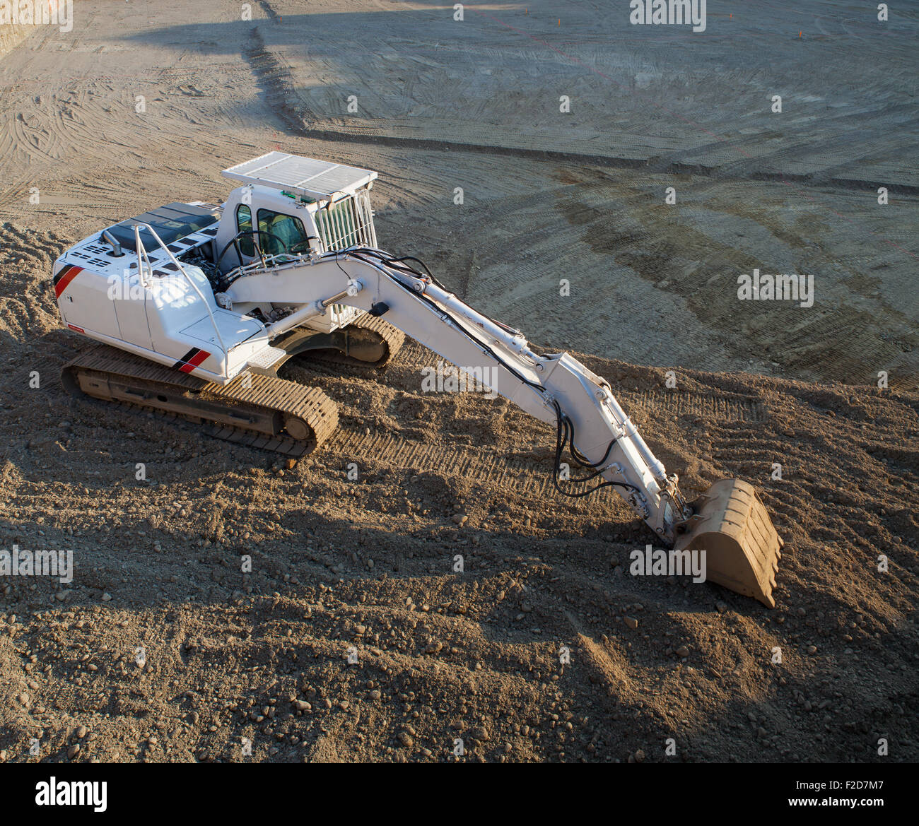 View of white excavator on the construction site Stock Photo