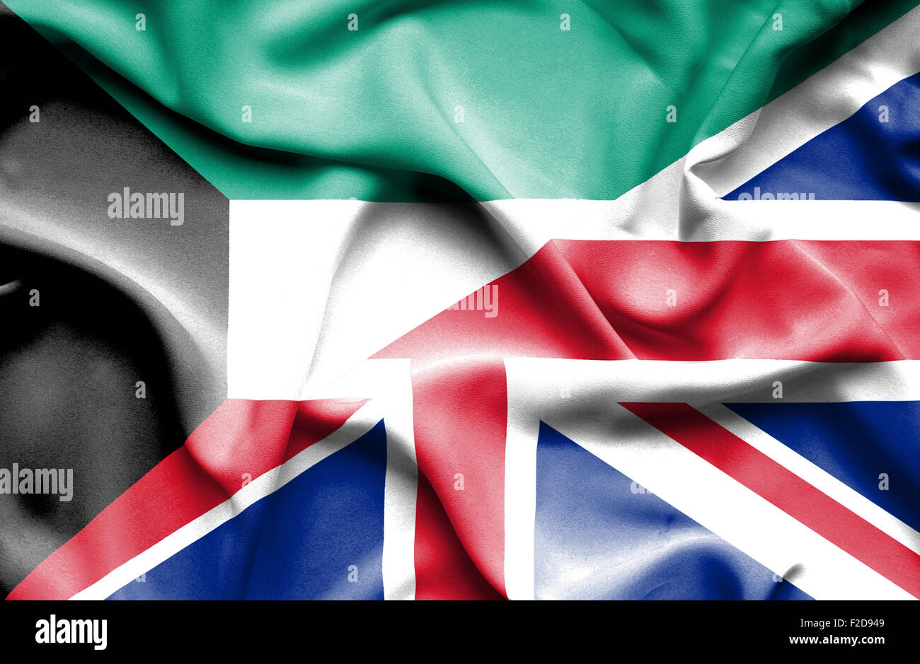 Waving flag of United Kingdom and Kuwait Stock Photo