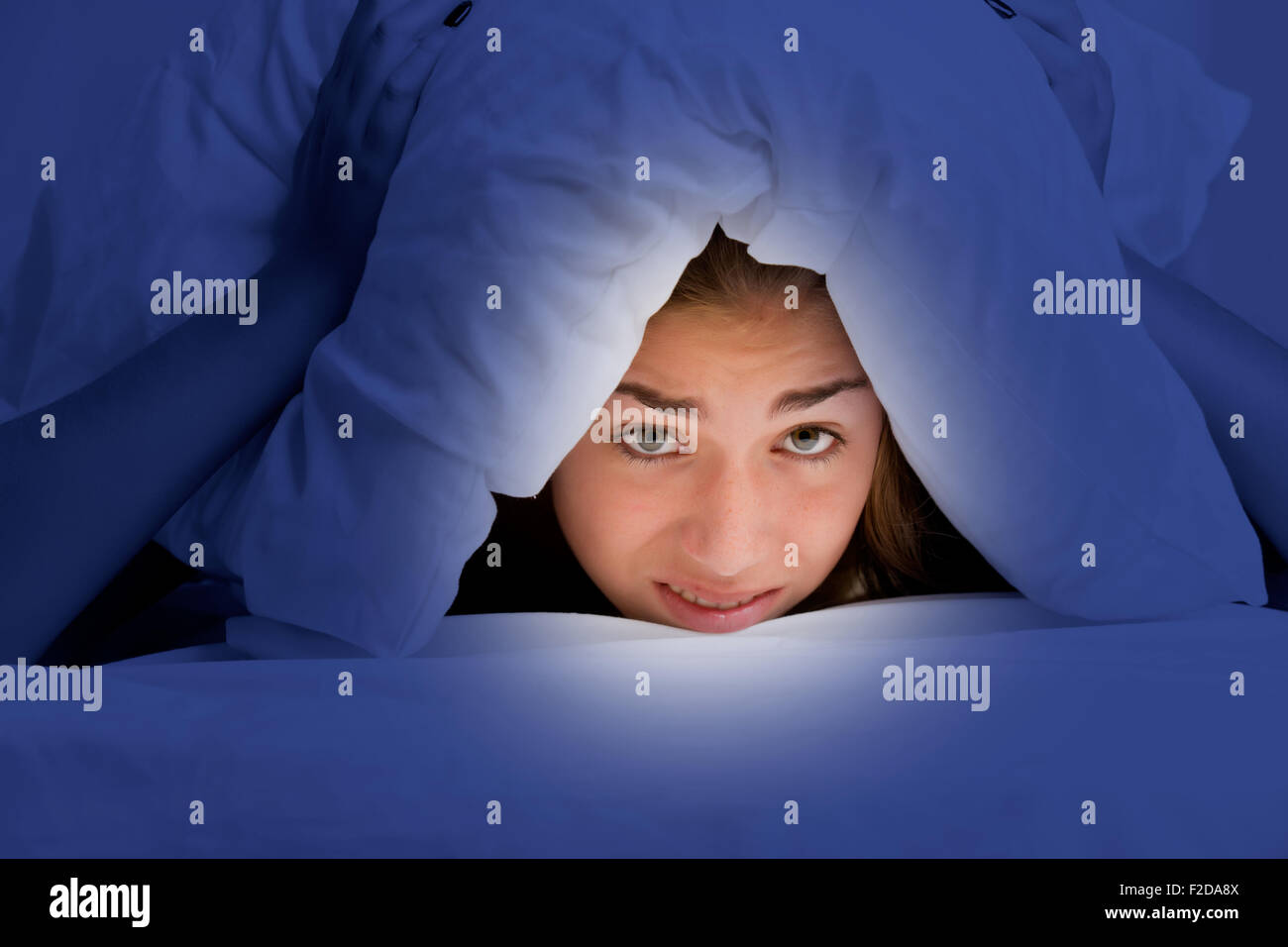 Woman With A Pillow Over Her Head Not Wanting To Get Out Of The Bed Woman with a pillow over her head not wanting to get out of the bed