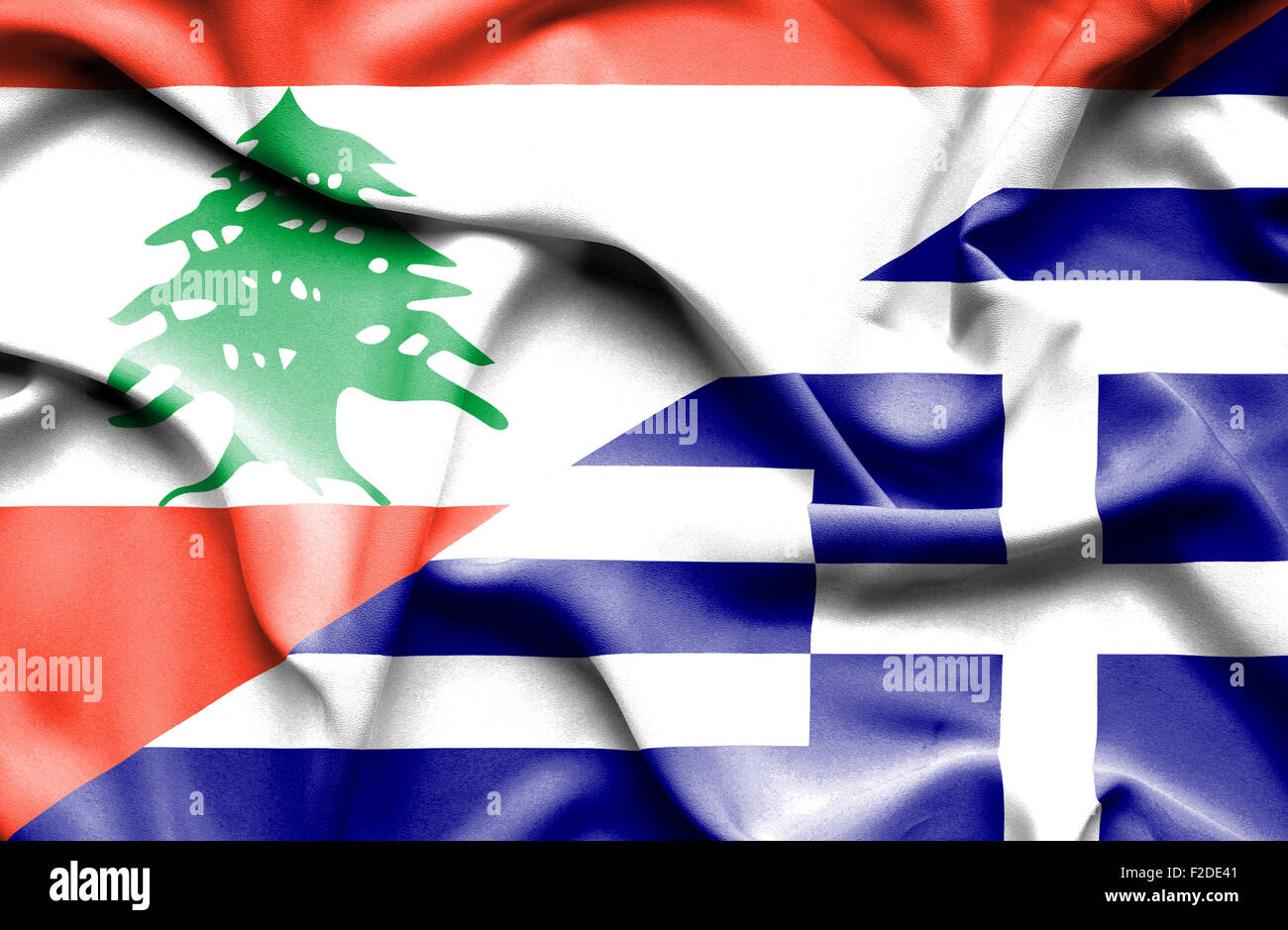 Waving flag of Greece and  Lebanon Stock Photo