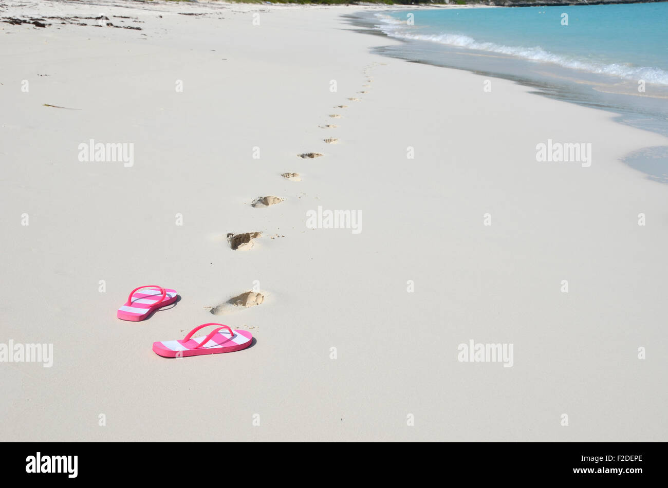 Flip-flops on the beach Stock Photo - Alamy