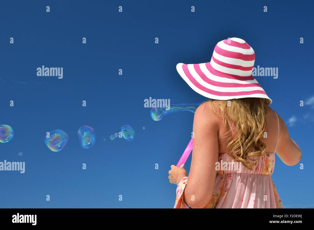 Girl making soap bubbles Stock Photo Alamy