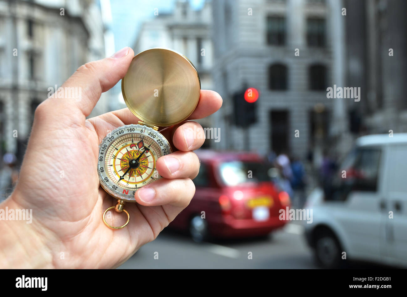 Compass in the hand on a street of London Stock Photo Alamy