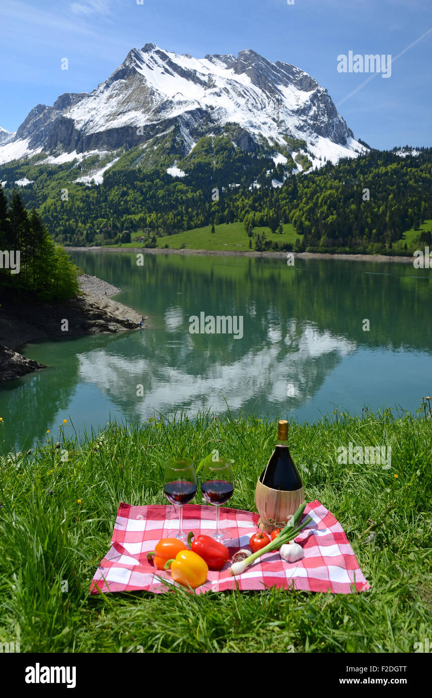 Wine and vegetables served at picnic on Alpine meadow. Switzerland Stock  Photo - Alamy