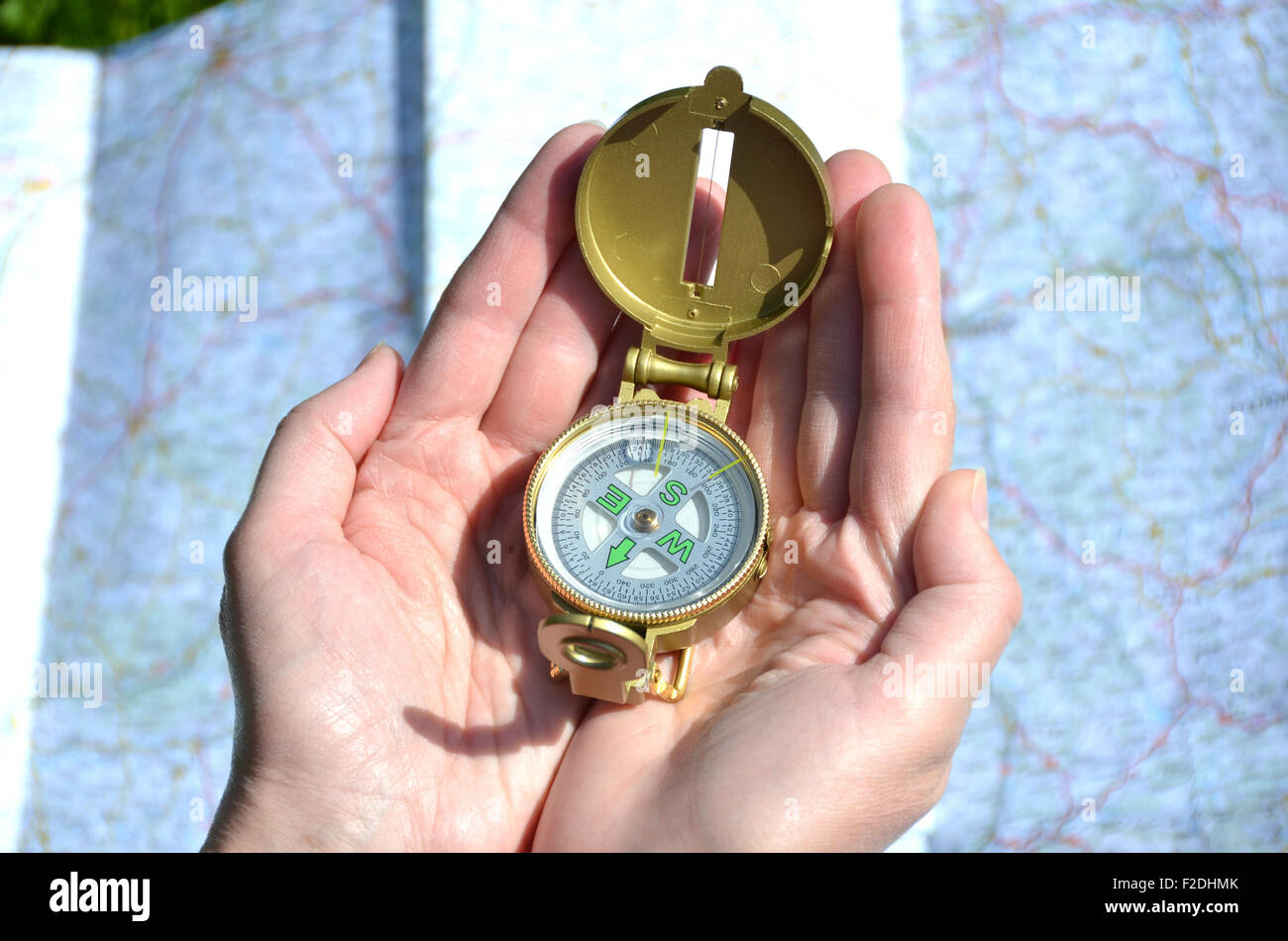 Compass in the hands Stock Photo Alamy