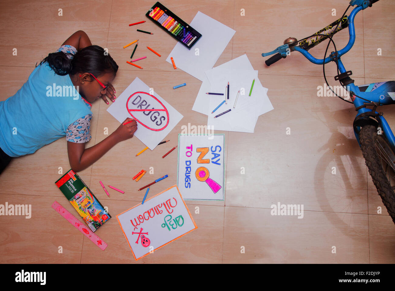 Child making posters against drugs Stock Photo