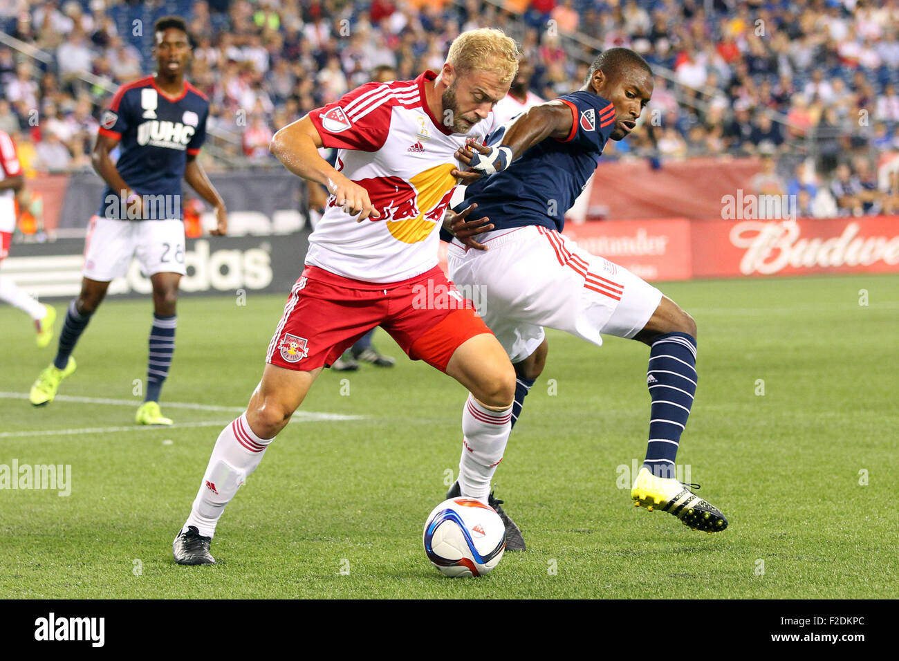 Foxborough, Massachussetts, USA. 16th September, 2015. New England Revolution defender Jose Goncalves (23) and New York Red Bulls forward Mike Grella (13) in action during the first half of the MLS game between the New England Revolution and New York Red Bulls at Gillette Stadium. Credit:  Cal Sport Media/Alamy Live News Stock Photo