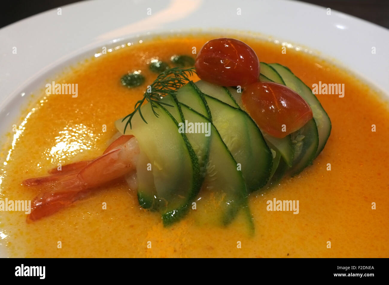 Shrimp rolled with cucumber in spicy sauce, fusion food Stock Photo