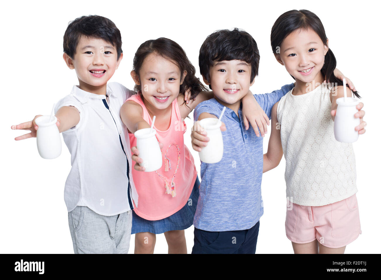 Happy children drinking yogurt Stock Photo - Alamy